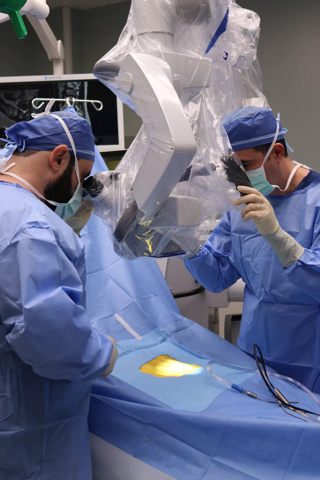 Dr. Yasmeh and surgical team performing robotic-assisted spine surgery